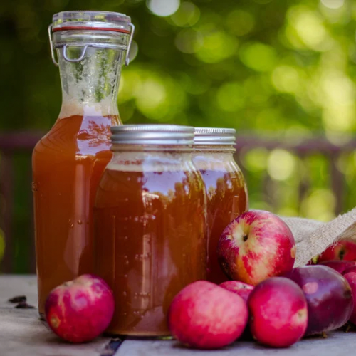 Fermenting homemade apple cider vinegar in a glass jar – part of a DIY wellness journey in Langley, BC.